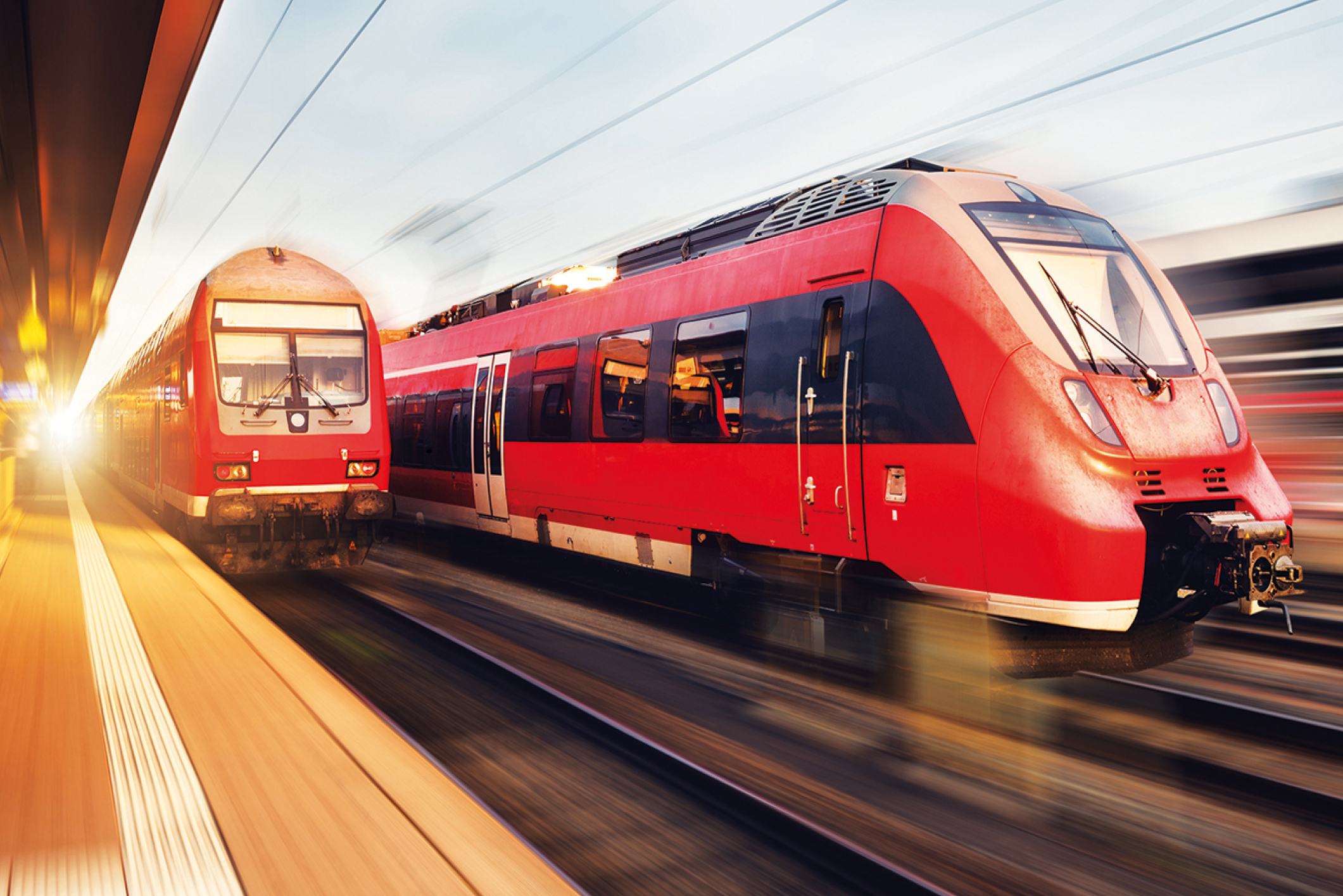 DB Regionalzüge mit Bewegungseffekt am Bahnhof