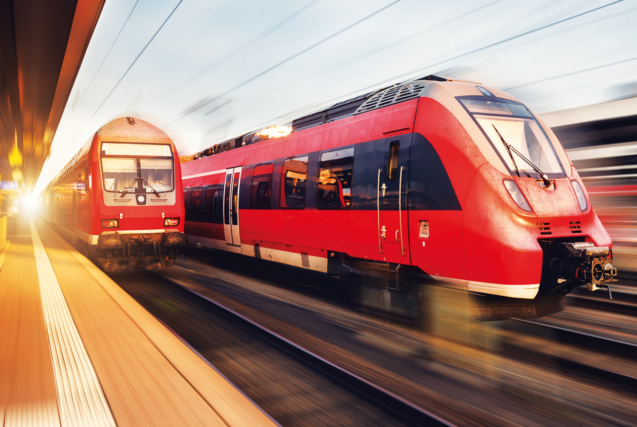 DB Regionalzüge mit Bewegungseffekt am Bahnhof